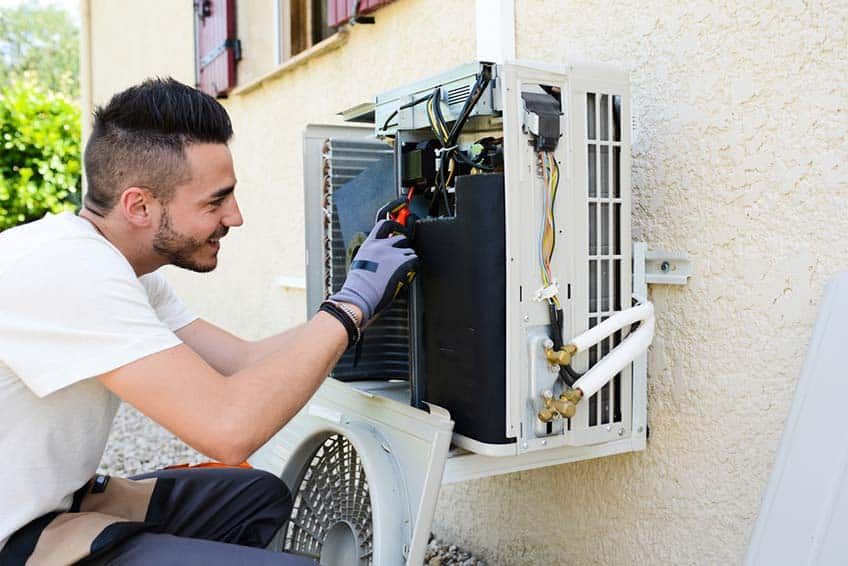 Air conditioning unit being checked by tehnician