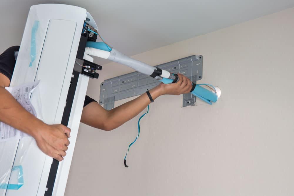 AC unit being installed by technician
