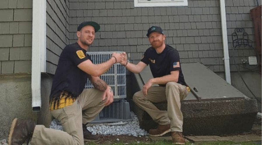 service techs helping one another complete job