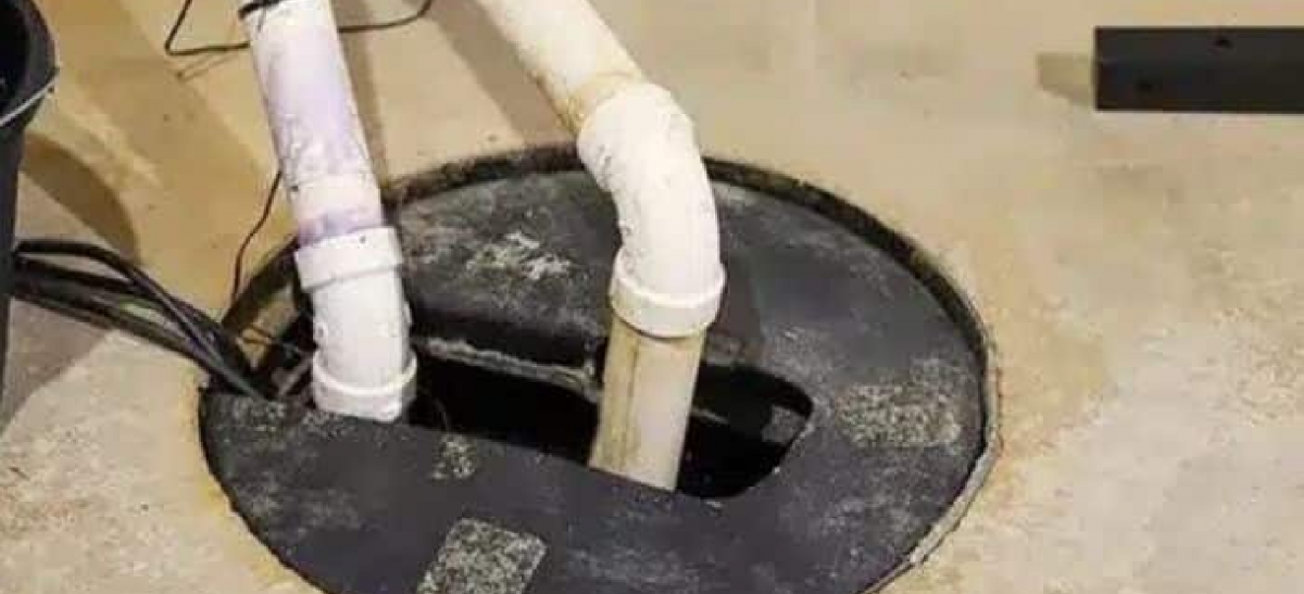 A Randolph home receiving sump pump repair services from Trust 1 Services.