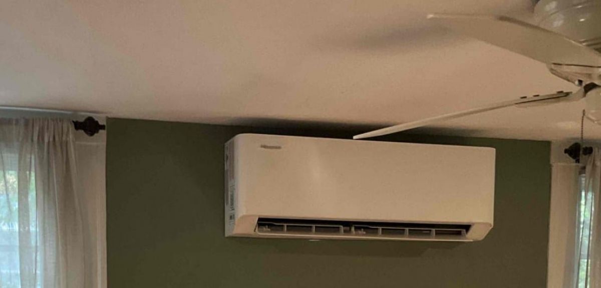 Ductless mini-split indoor unit installed by Trust 1 on a bedroom wall
