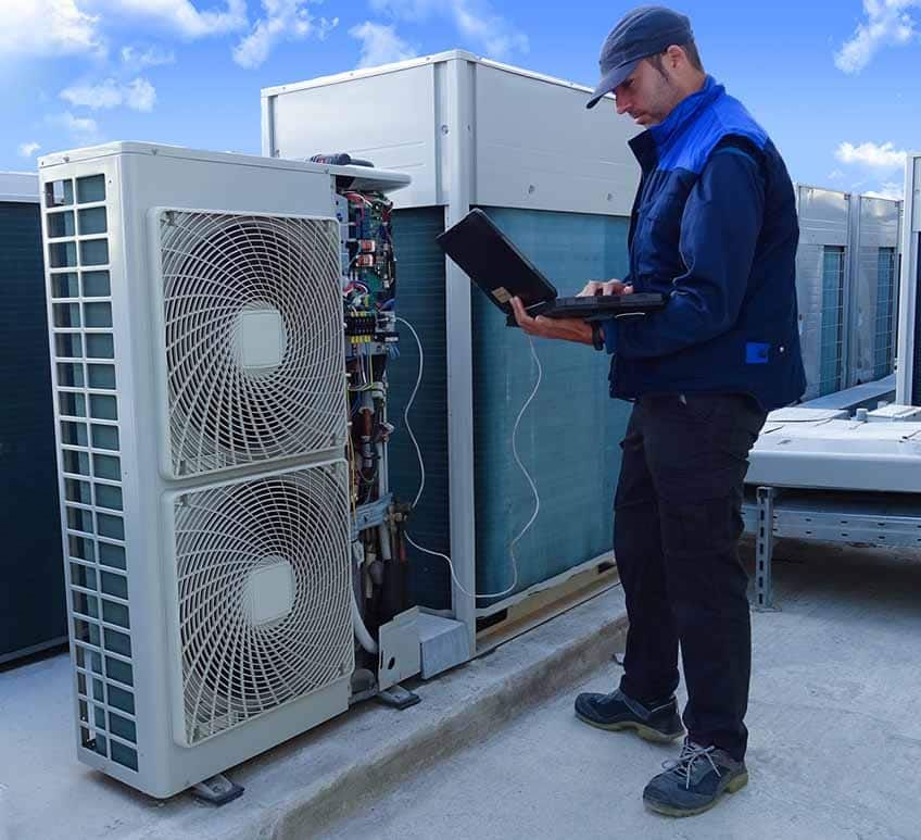 HVAC system being inspected by a technician