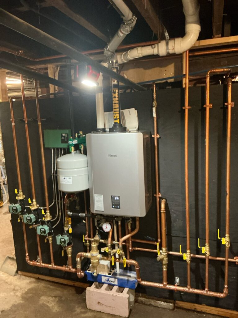 Rinnai high-efficiency combi boiler installed by Trust 1 with new copper piping and zone circulators