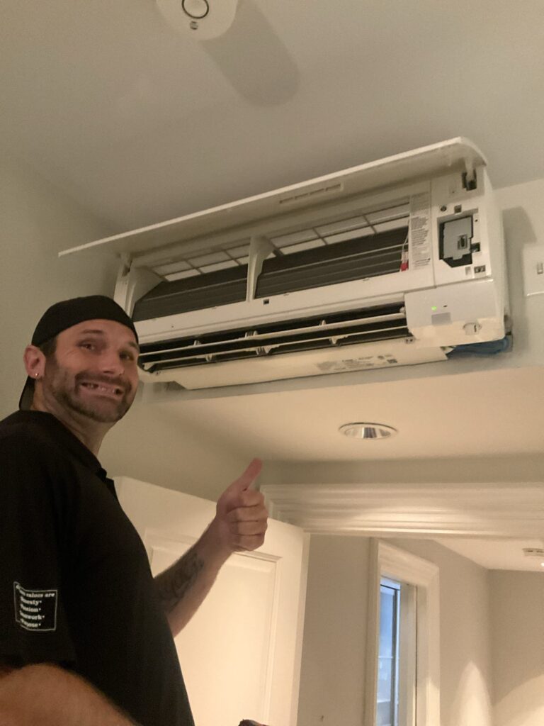 Trust 1 technician repairing a ductless mini-split indoor unit